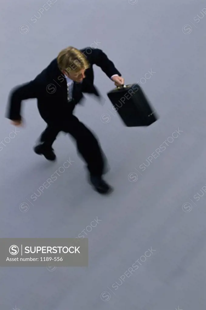 High angle view of a businessman walking up a staircase
