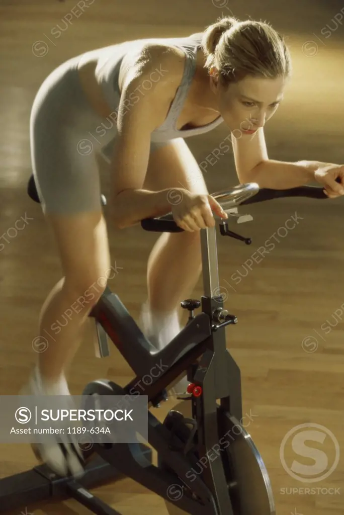 High angle view of a mid adult woman exercising in a gym