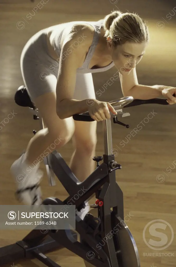 High angle view of a mid adult woman exercising in a gym