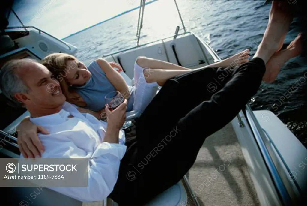High angle view of a senior couple embracing on a boat