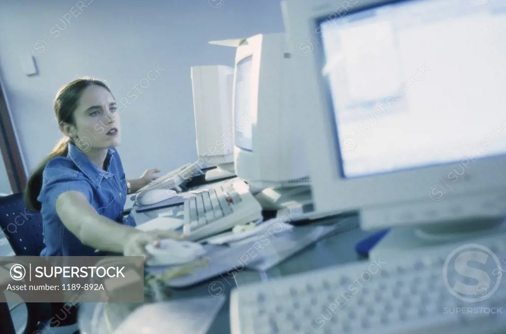 Side profile of a businesswoman using a computer