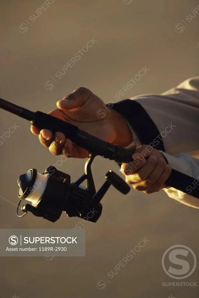 Person holding a fishing rod