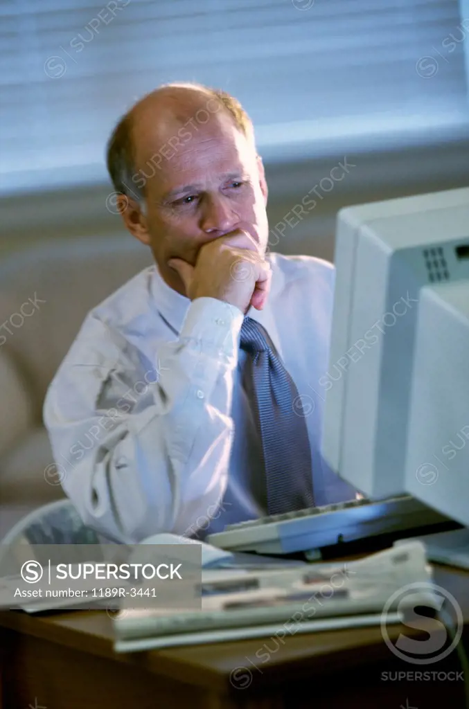 Businessman sitting in front of a computer