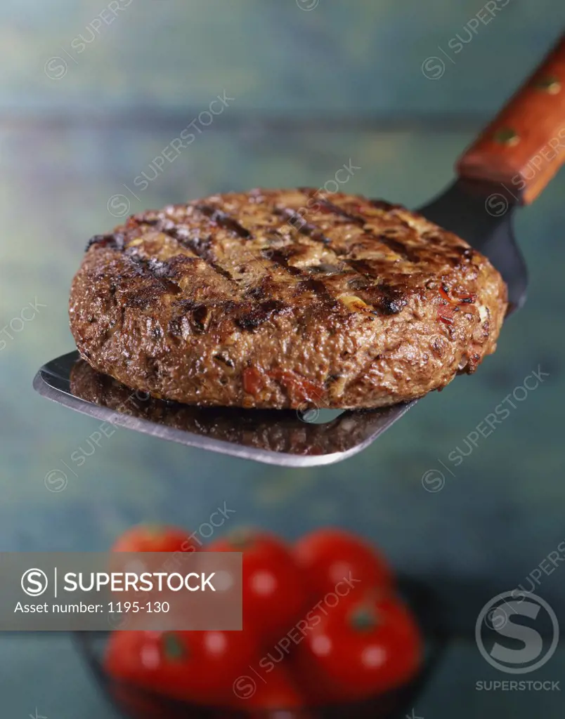 Grilled hamburger on a spatula