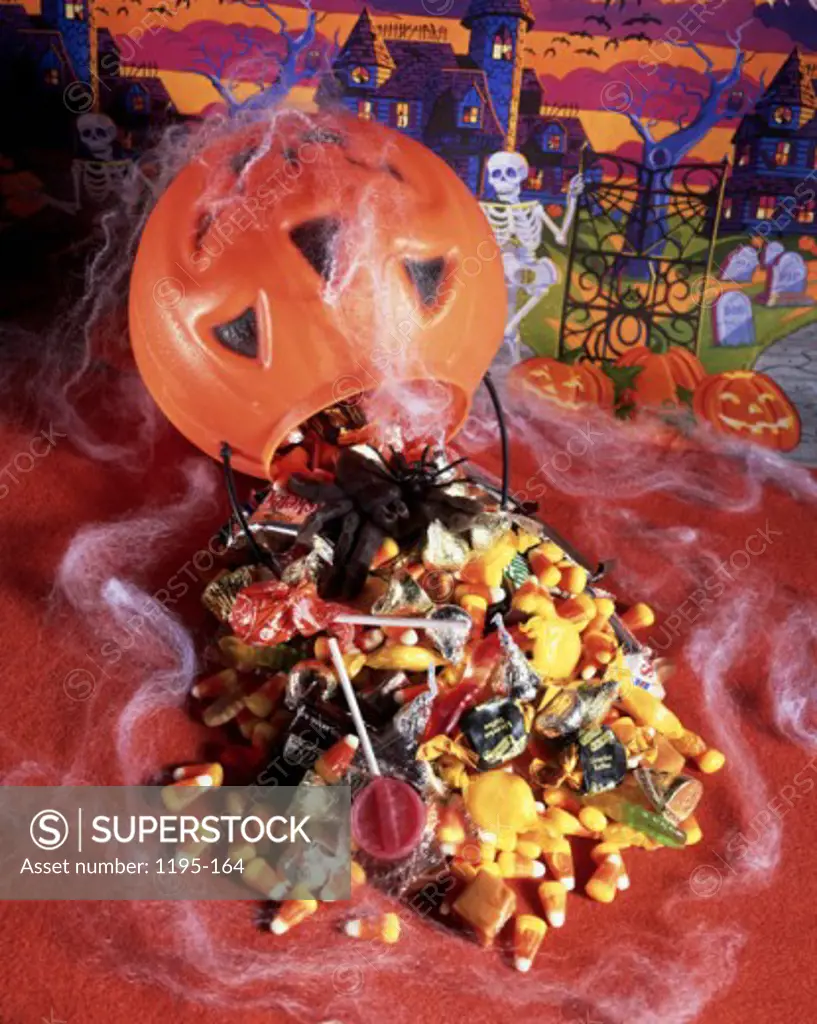 Close-up of candies spilled out from a jack o' lantern
