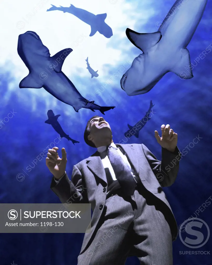 Sharks circling over a businessman