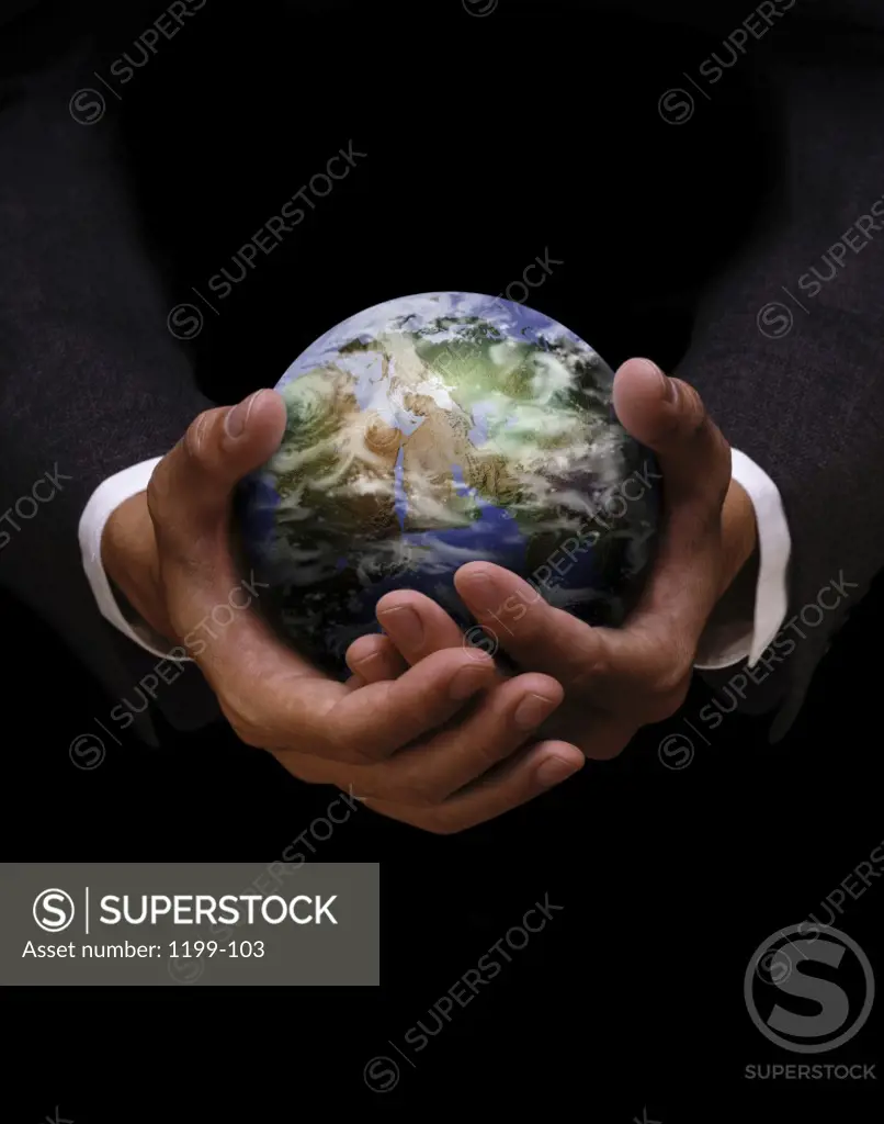Businessman holding a globe