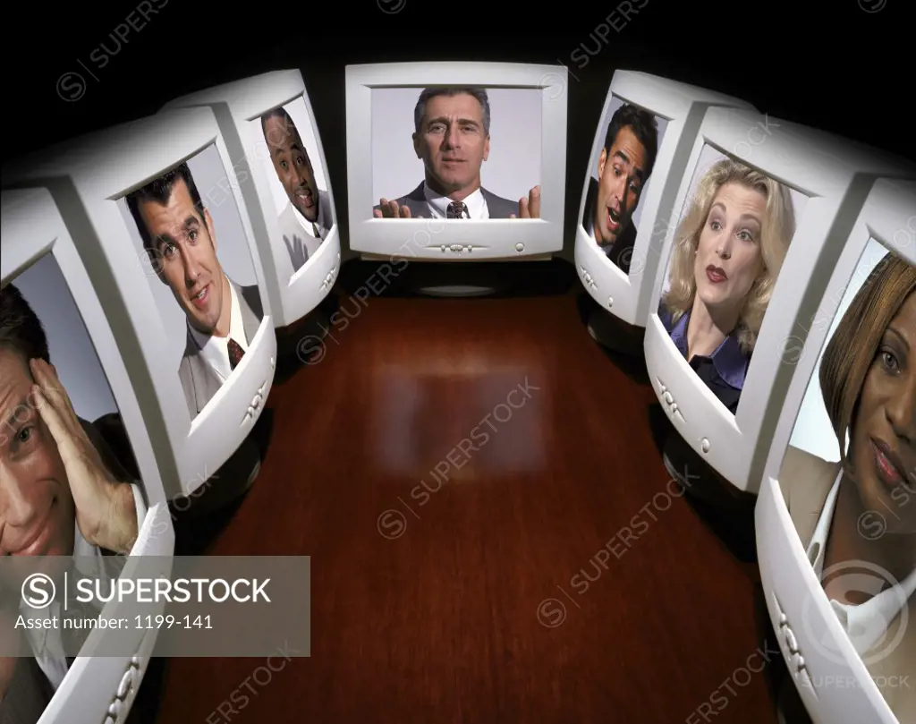 Business executives on computer monitors
