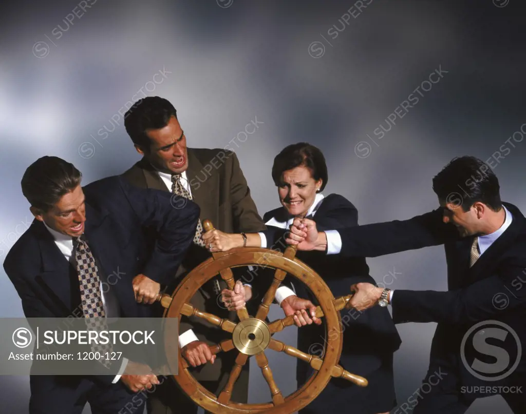 Business executives steering a ship