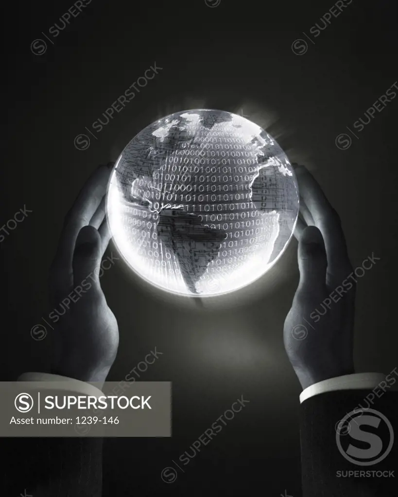 Close-up of a businessman holding a glowing globe