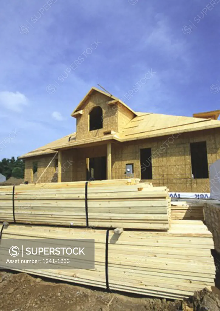 Wooden planks in front of a house under construction
