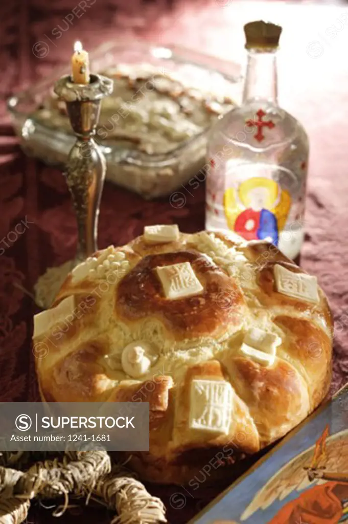 Close-up of slava bread with a wine bottle