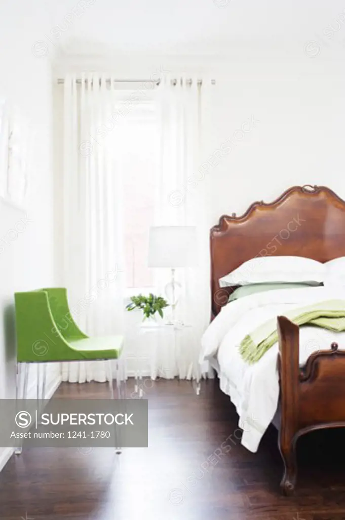 Chair near the bed in a bedroom
