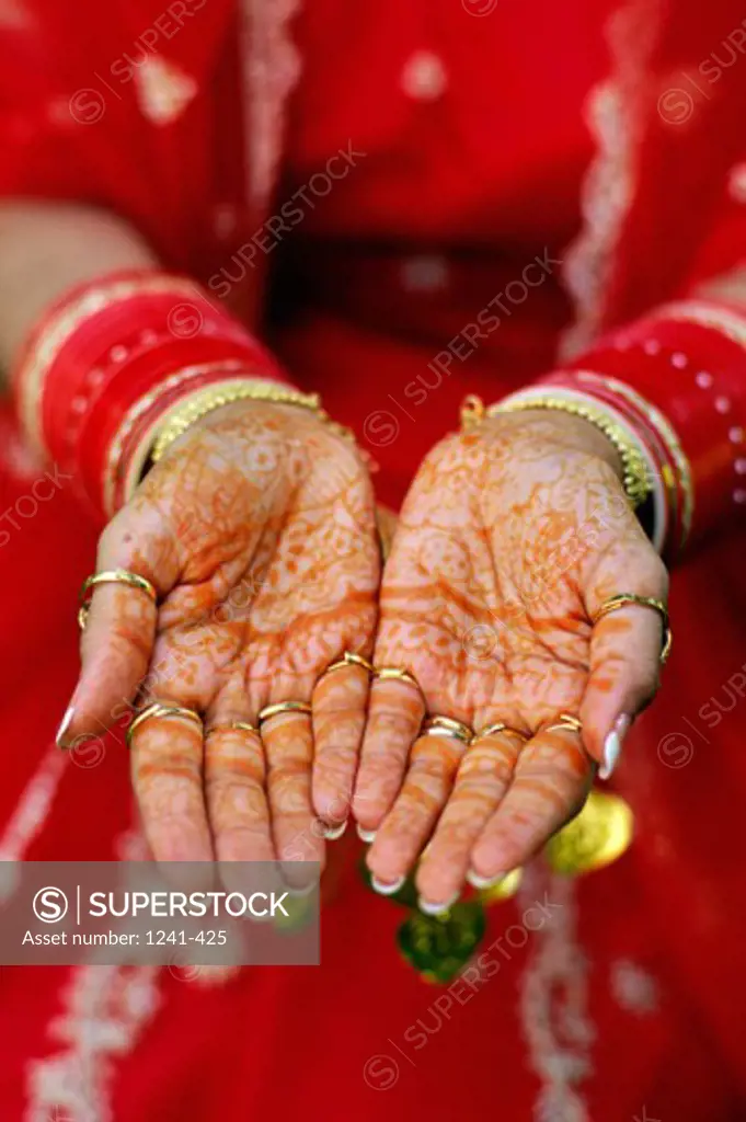Close-up of a woman's hands adorned with mehndi