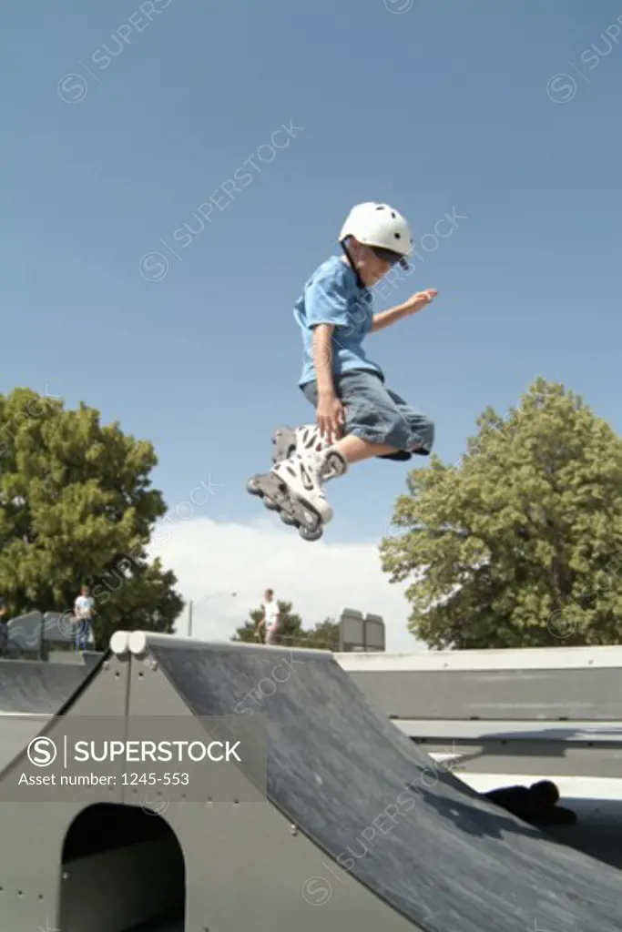 Low angle view of a boy inline skating