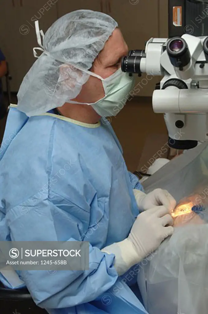 Female surgeon operating on a patient's eye