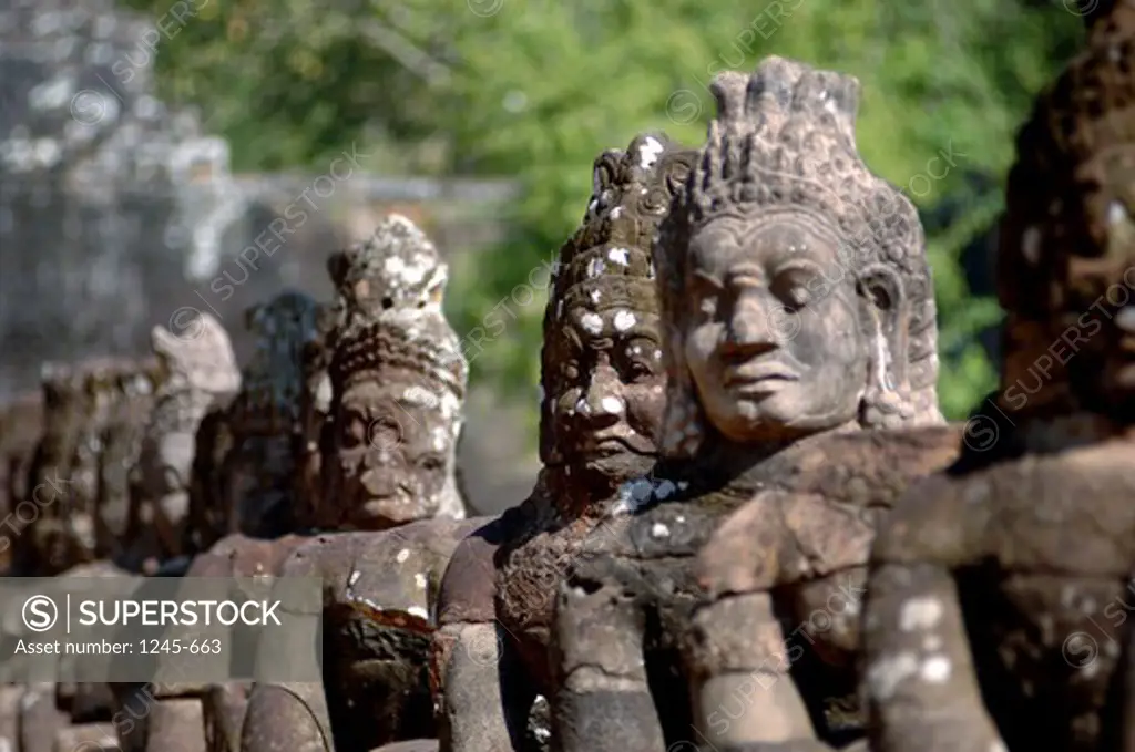 Cambodia, Siem Reap, Angkor Wat, close up of ancient statues