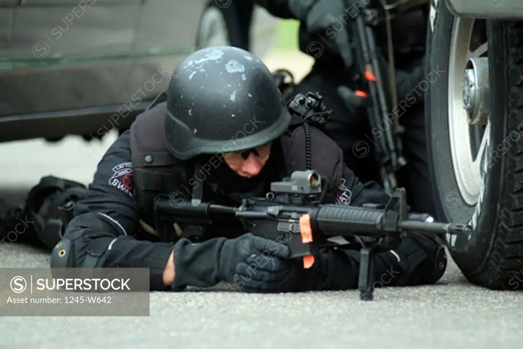 Two SWAT team members taking position