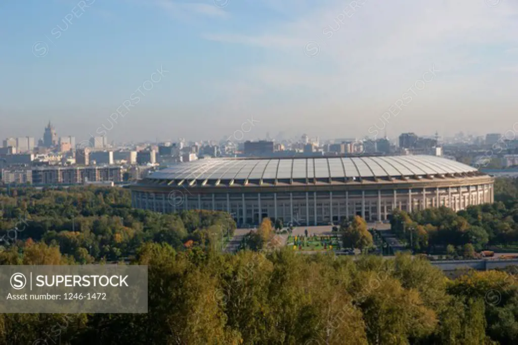 RUSSIA, Moscow: Sport-Stadion in front, skyline modern city at rear