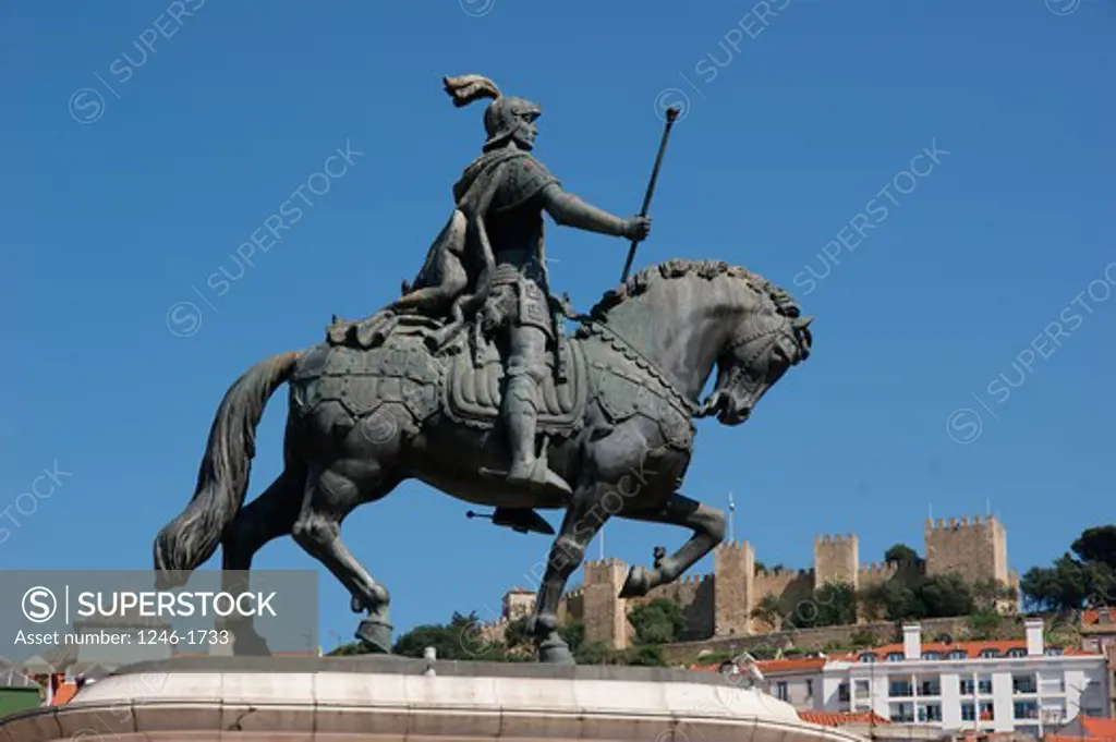 PORTUGAL, Lisbon: Monument of King Joao I. at the Praca da Figueira, Castle above