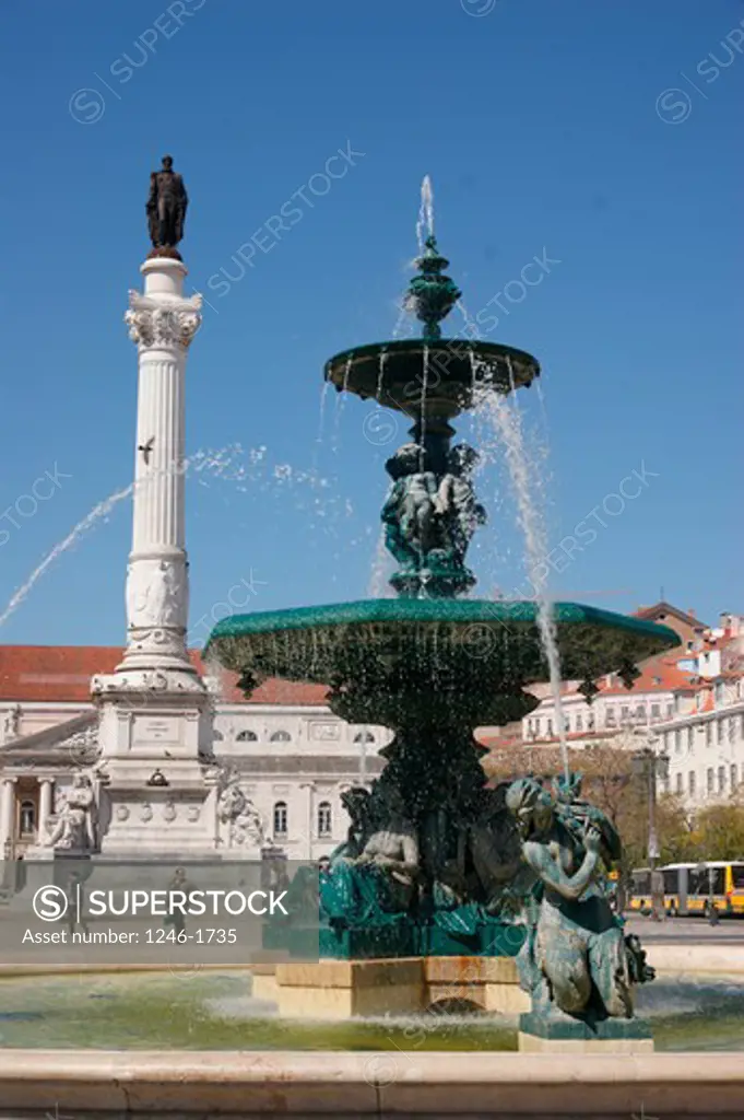 PORTUGAL, Lisbon: Fopuntain, monument of King Pedro IV, National Theater at rear on the Praca Rossio (Praca de Dom Pedro IV)