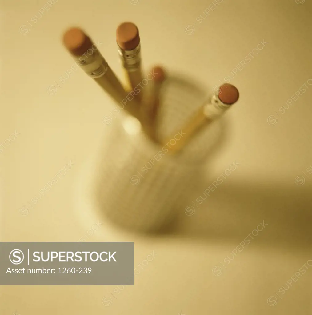 High angle view of four pencils in a container