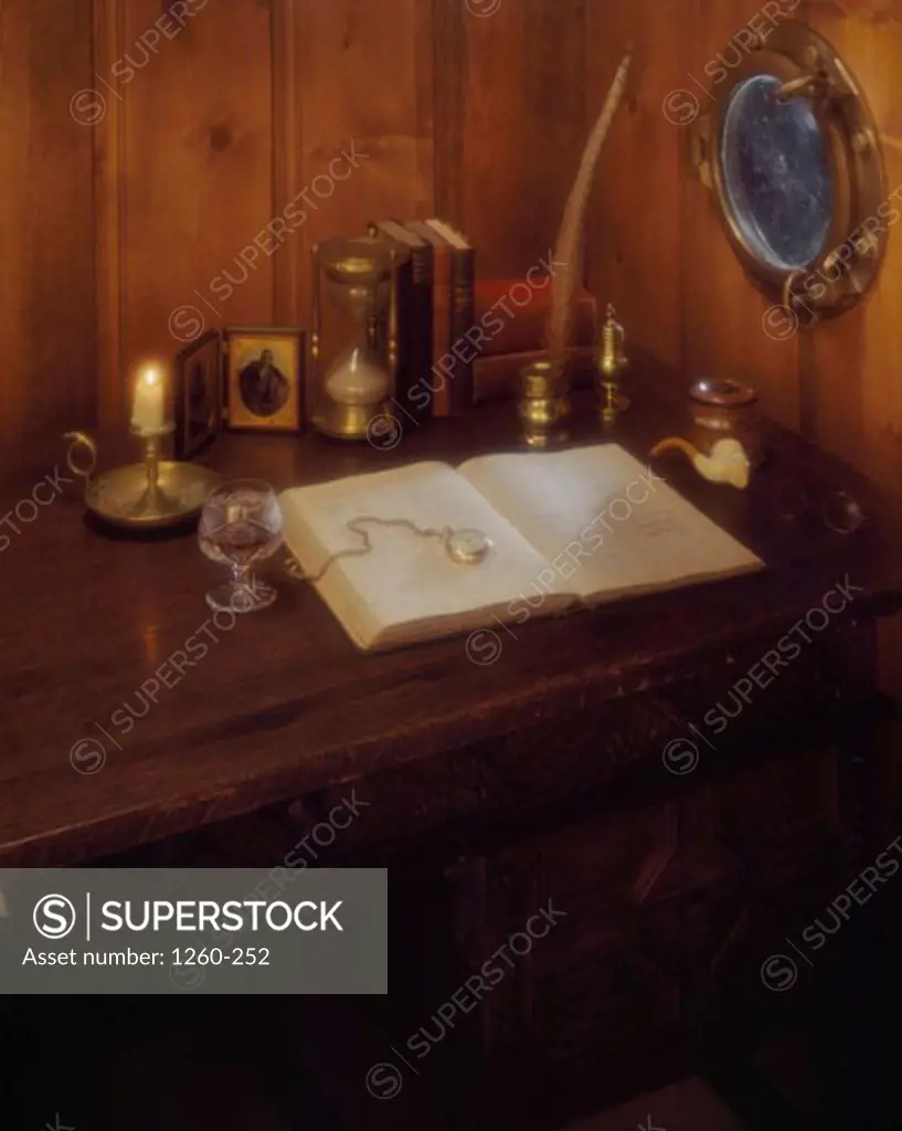 High angle view of a pocket watch on a book on a boat