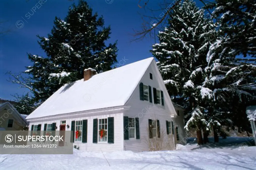 House in a snow covered landscape, Woodstock, Vermont, USA