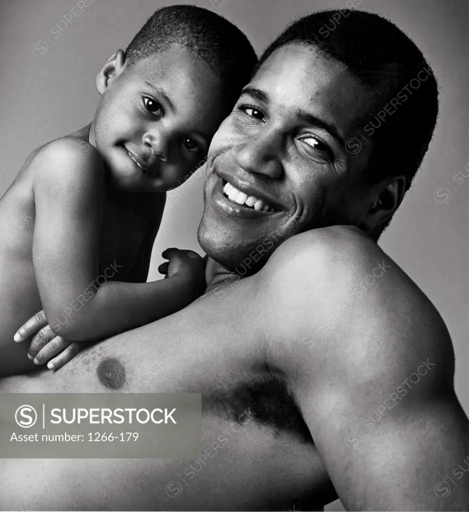 Portrait of a father and his son smiling