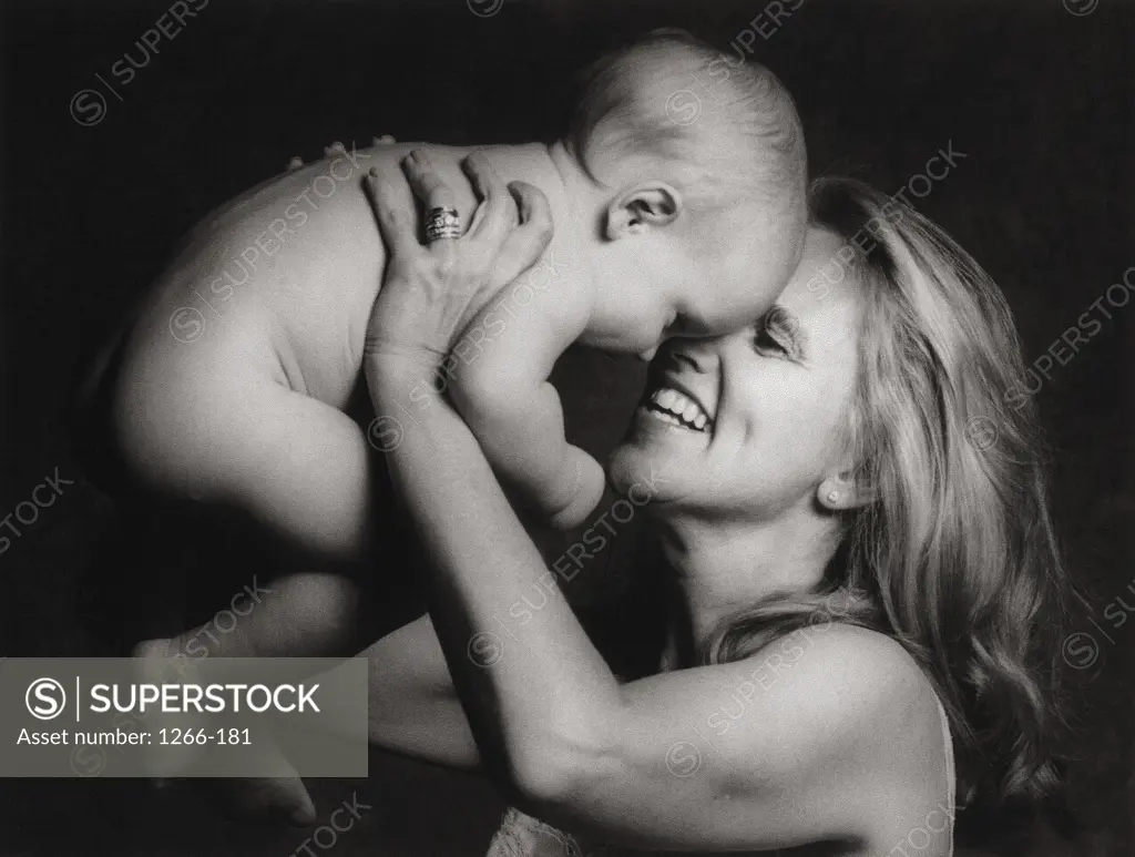 Side profile of mother holding a child