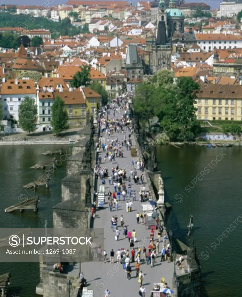 High angle view of a large group of people walking on a bridge, Old Town Bridge Tower, Charles Bridge, Prague, Czech Republic