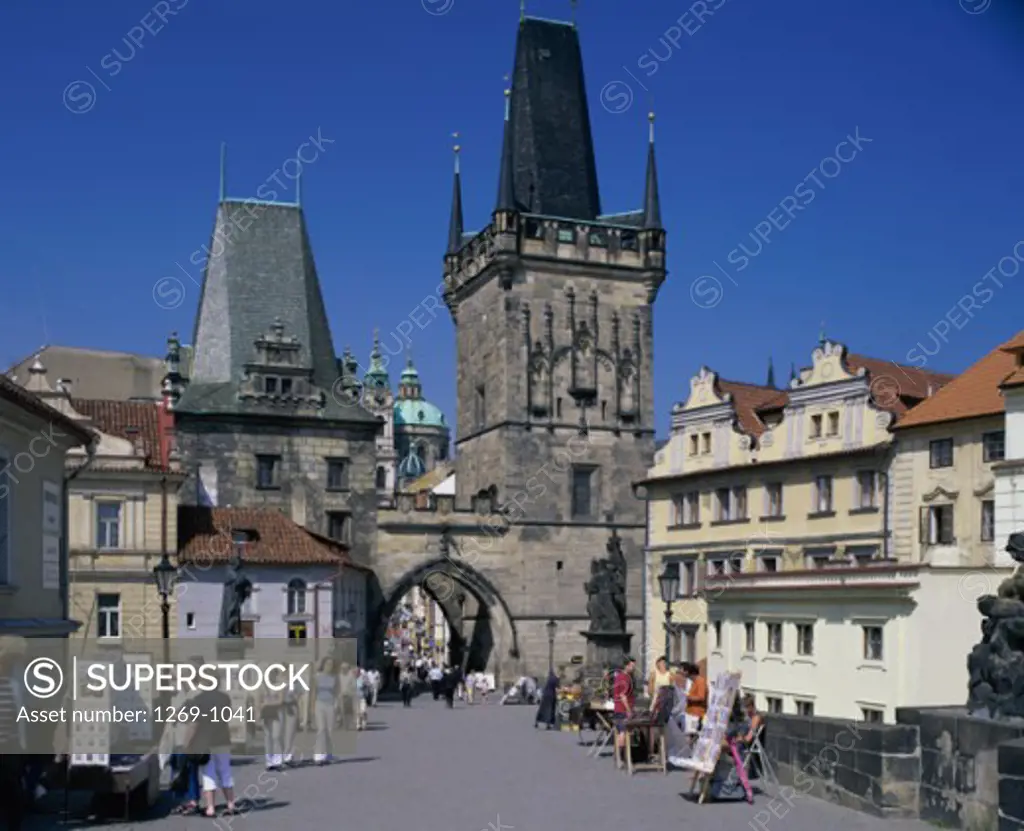 Tourists walking on the bridge, Old Town Bridge Tower, Charles Bridge, Prague, Czech Republic