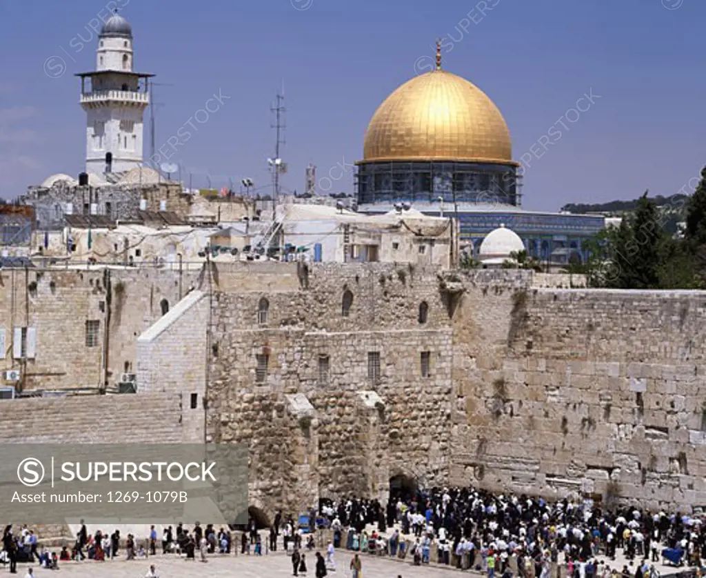 High angle view of a large group of people praying in front of a stone wall, Wailing Wall, Dome of the Rock, Jerusalem, Israel