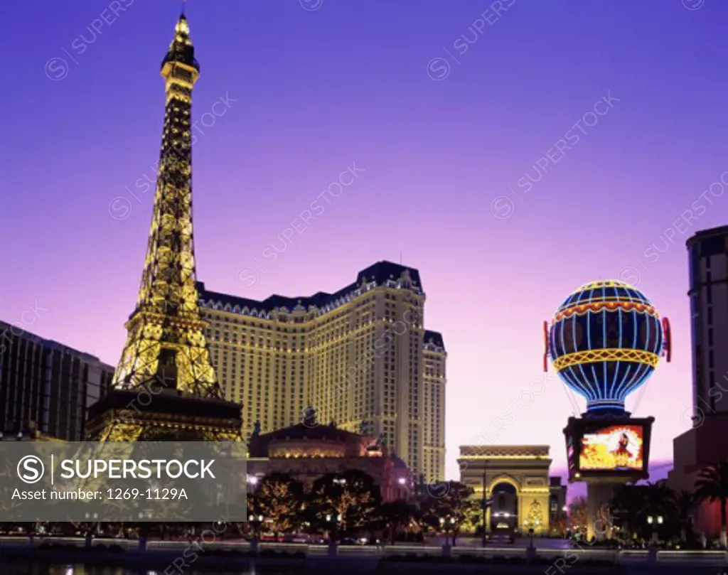 Low angle view of a replica of the Eiffel Tower lit up at dusk, Paris Las Vegas Hotel and Casino, Las Vegas, Nevada, USA