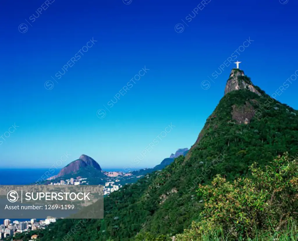 Low angle view of a statue on a top of a mountain, Christ the Redeemer Statue, Mount Corcovado, Rio de Janeiro, Brazil