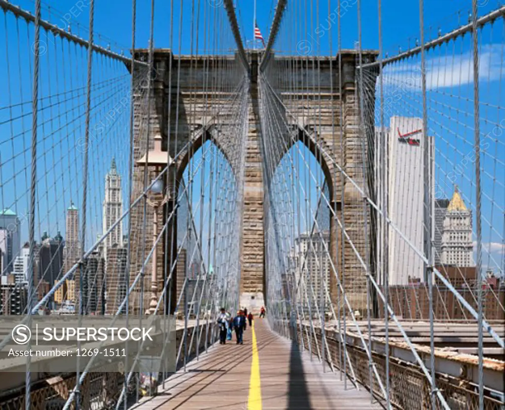 People walking on a bridge, Brooklyn Bridge, New York City, New York, USA