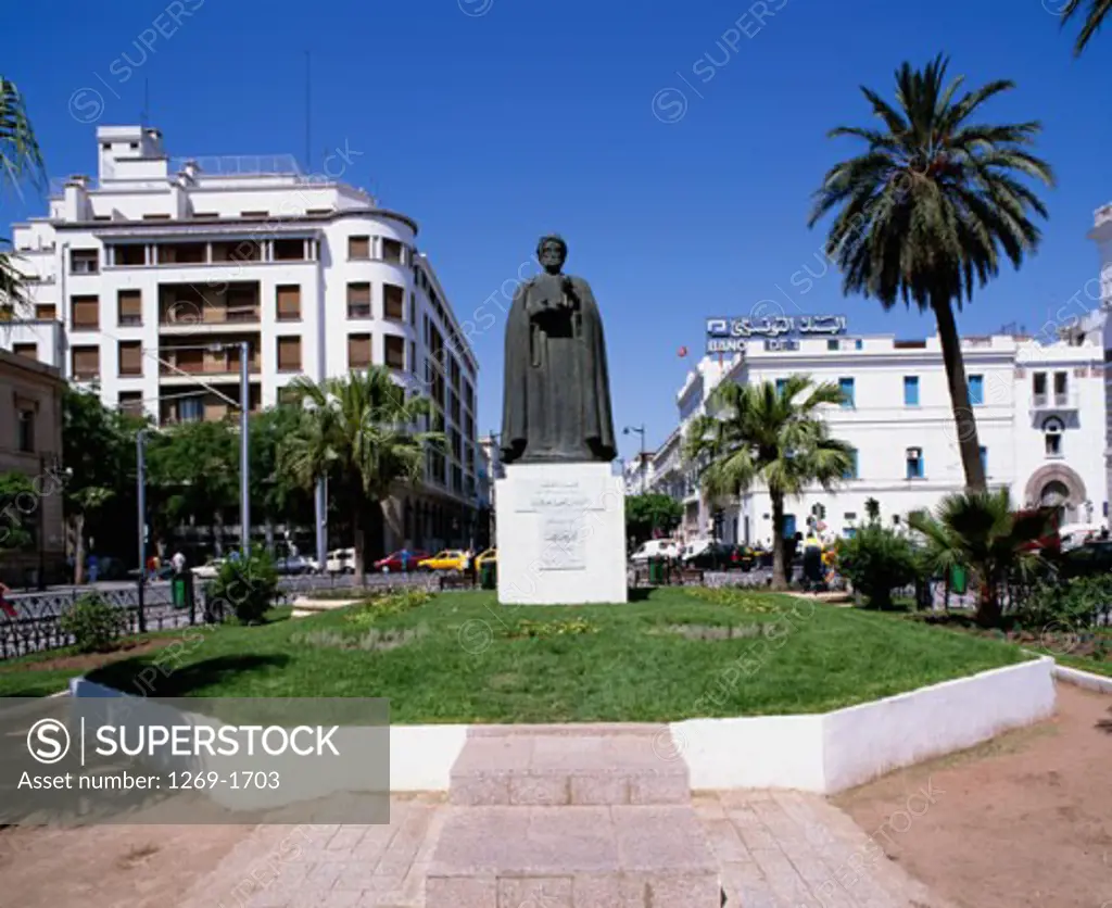 Statue in front of buildings, Statue of Ibn Khaldoun, Independence Square, Avenue Habib Bourguiba, Tunis, Tunisia