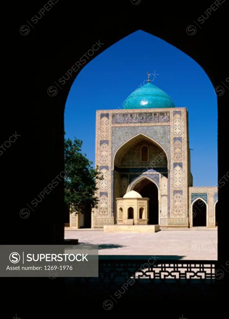 Facade of a mosque seen through an arch, Kalyan Mosque, Bukhara, Uzbekistan