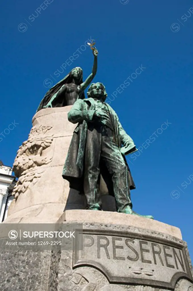 Low angle view of a statue of France Preseren on a pedestal, Ljubljana, Slovenia