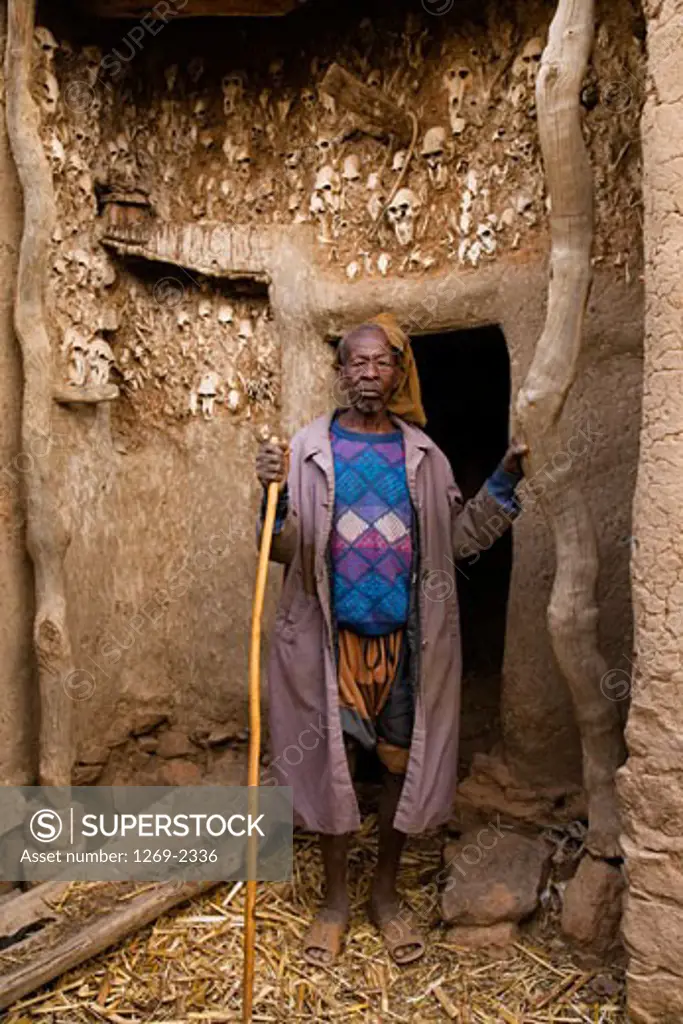 Senior man standing in a doorway, Sangha, Bandiagara Escarpment, Mali