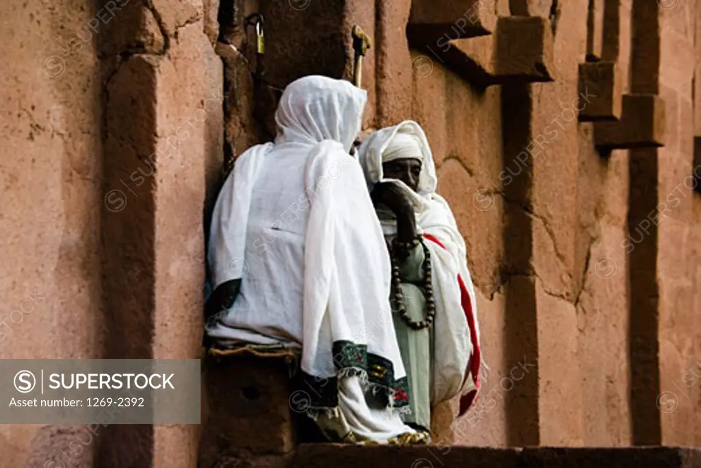 Two nuns in front of a church, St. Abba Libanos Church, Lalibela, Ethiopia
