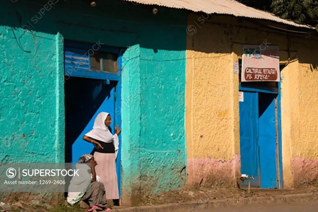 Two women at the entrance of a house, Gondar, Ethiopia