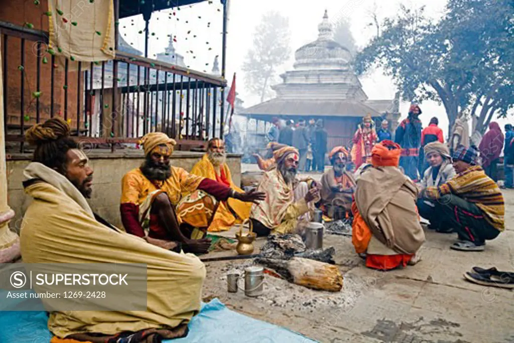 Group of sadhus sitting together at a religious festival, Maha Shivaratri, Pashupatinath Temple, Kathmandu, Nepal