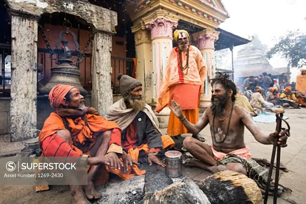 Four sadhus outside a temple at a religious festival, Maha Shivaratri, Kathmandu, Nepal