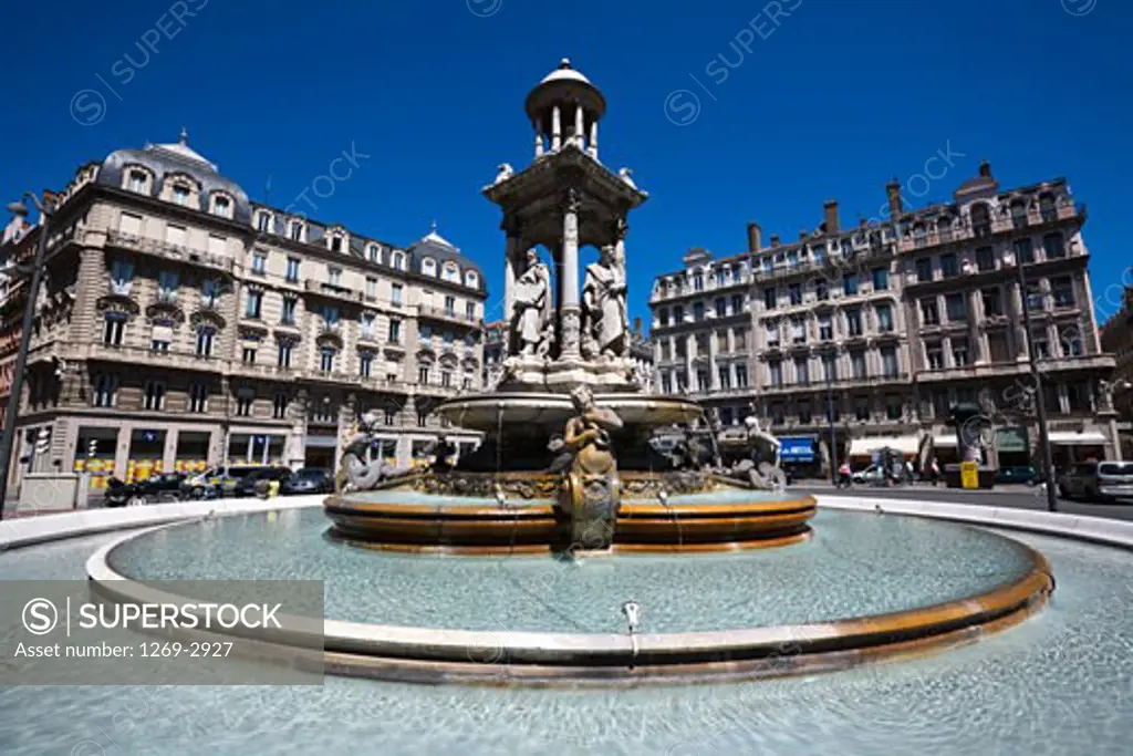 Low angle view of a fountain at a town square, Place des Jacobins, Lyon, Rhone-Alpes, France