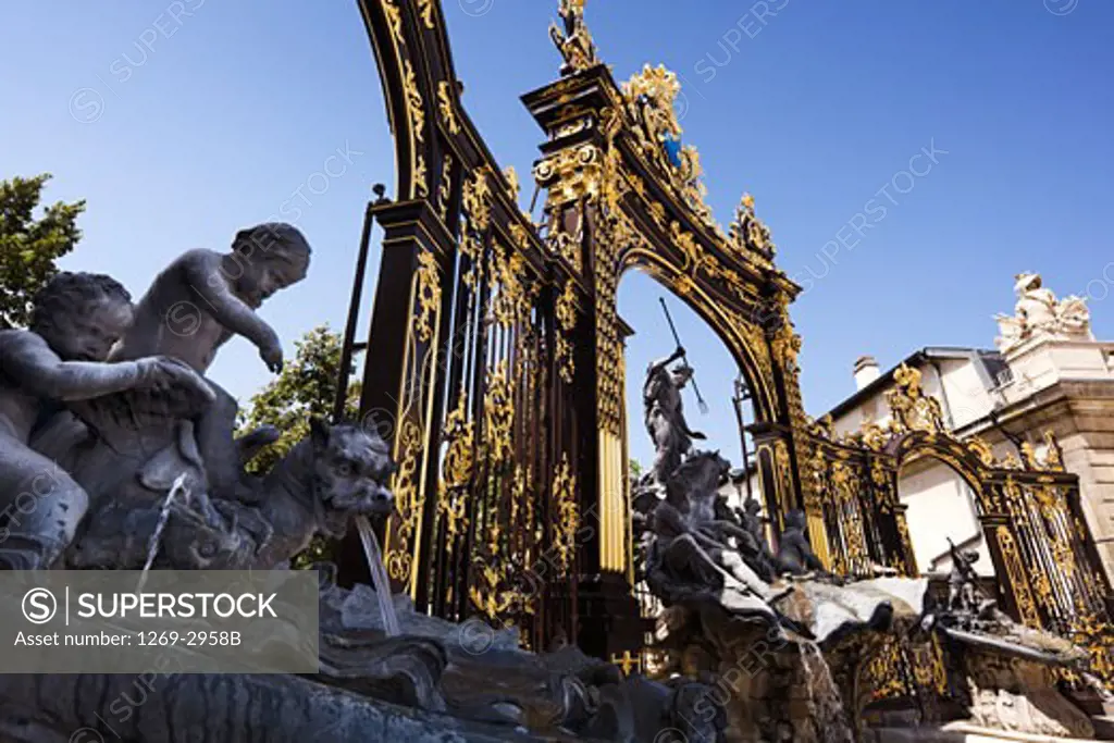 Fountains in front of gilded gates, The Neptune Gate, Fountain of Amphitrite, Place Stanislas, Nancy, Meurthe-et-Moselle, France