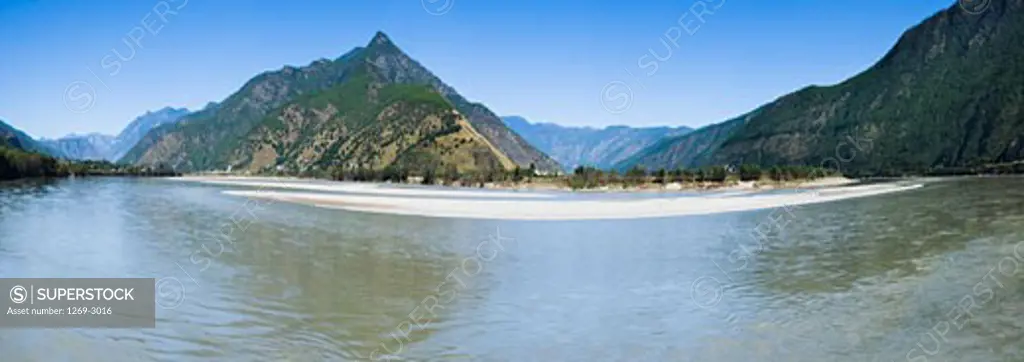 River with a mountain range in the background, Yangtze River, Shigu Town, Lijiang, Yunnan Province, China