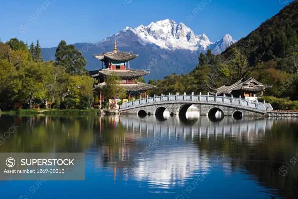 Bridge across a pond, Black Dragon Pool, Jade Dragon Snow Mountain, Lijiang, Yunnan Province, China