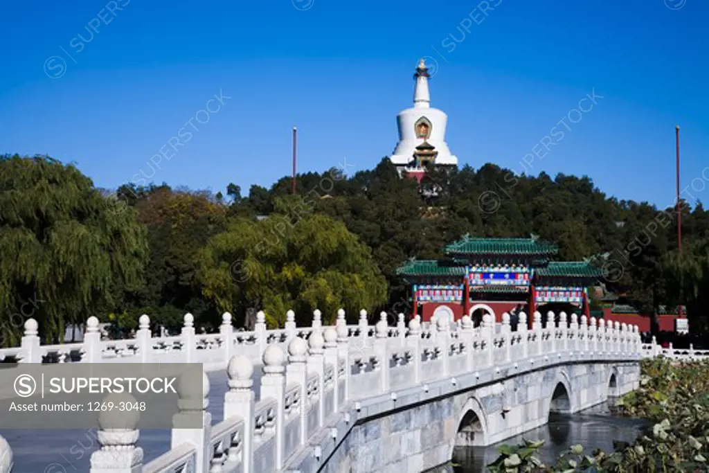 Bridge with a temple in the background, Yong An Bridge, Yong An Temple, Beihai Park, Beijing, China