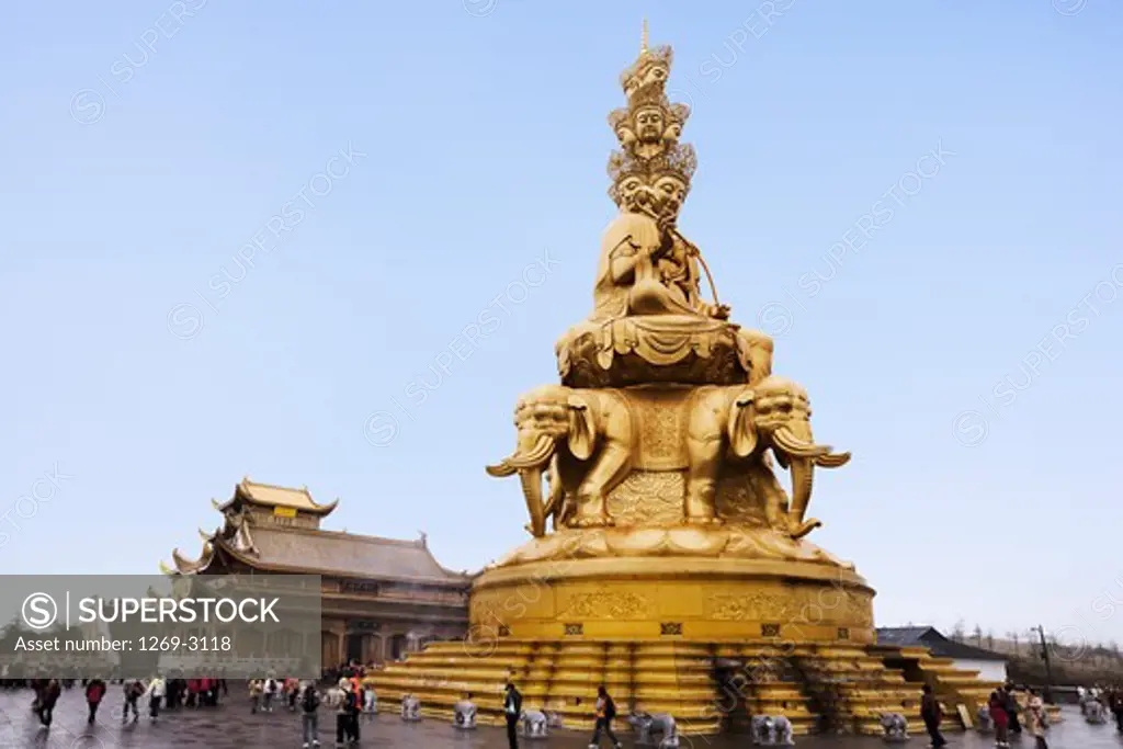 Low angle view of a statue of Buddha on a temple, Jinding Temple, Huazang Temple, Mt Emei, Mount Emei Scenic Area, Leshan Giant Buddha Scenic Area, Sichuan Province, China